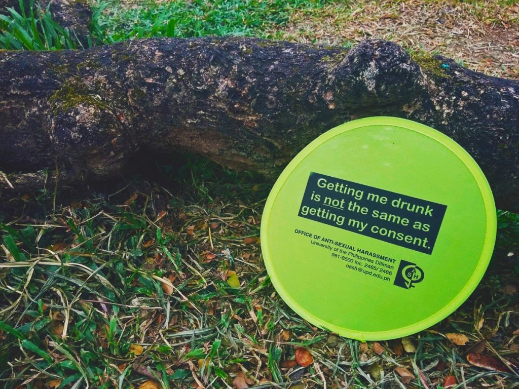 Getting me drunk is not the same as getting my consent Written on a fan with OASH's contact details.